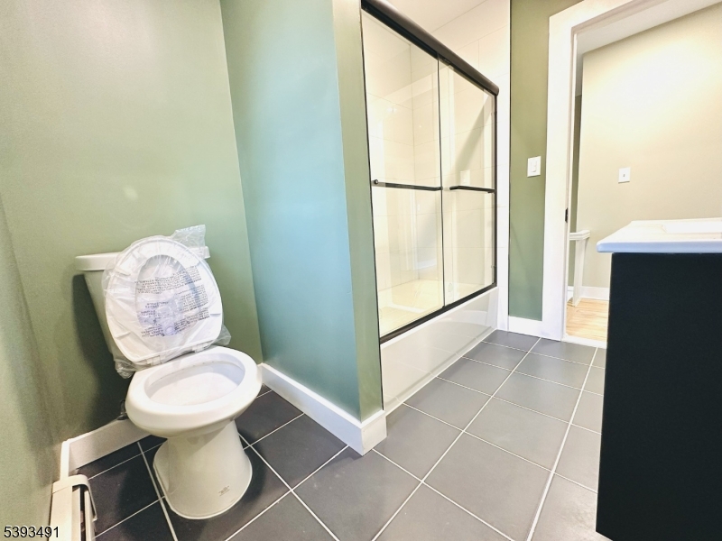 1222 West 3rd Street Plainfield, NJ 07063 - Photo 35 of 50 a bathroom with a toilet and a vanity