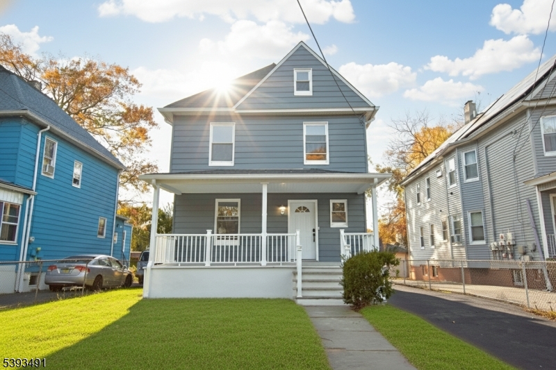 1222 West 3rd Street Plainfield, NJ 07063 - Photo 4 of 50 a front view of a house with a yard