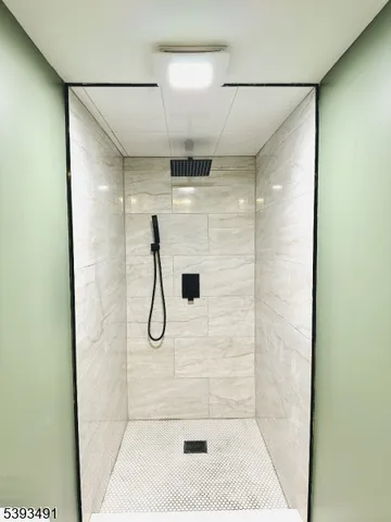 a bathroom with a glass shower door