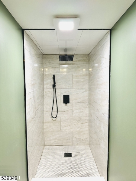 1222 West 3rd Street Plainfield, NJ 07063 - Photo 43 of 50 a bathroom with a glass shower door