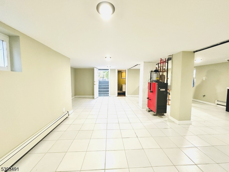 1222 West 3rd Street Plainfield, NJ 07063 - Photo 47 of 50 a view of a entryway with furniture and a window