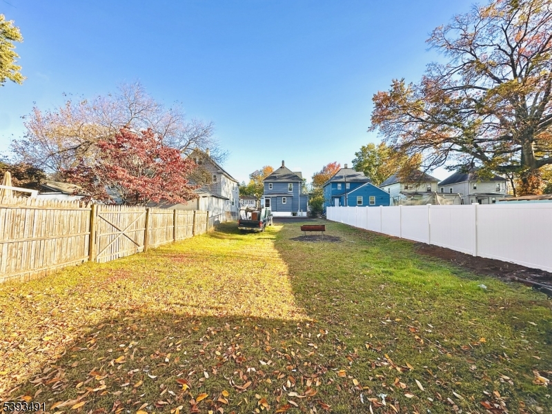 1222 West 3rd Street Plainfield, NJ 07063 - Photo 49 of 50 a view of yard with swimming pool and trees