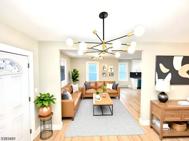 a living room with furniture and a chandelier