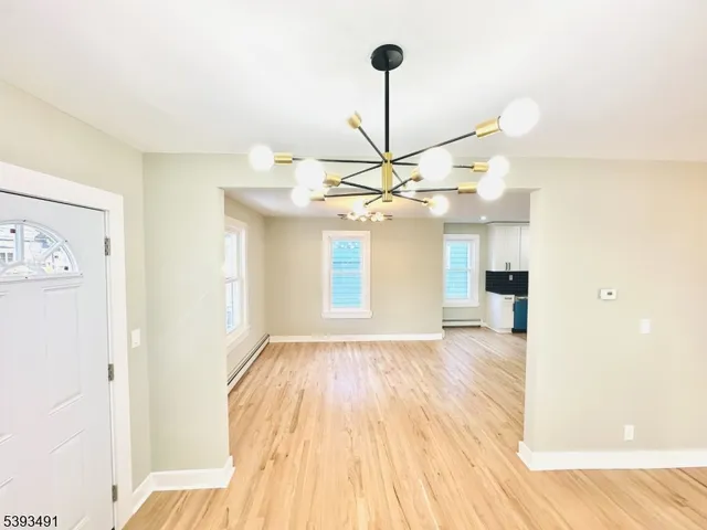 a view of a room with a wooden floor