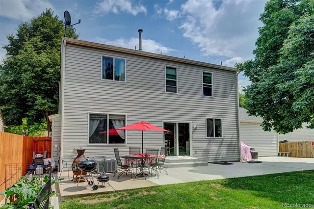 a front view of house with yard and outdoor seating