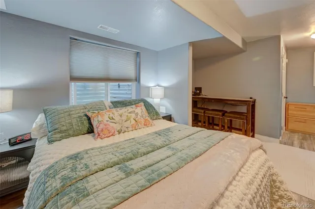 a bedroom with a bed and a cabinets