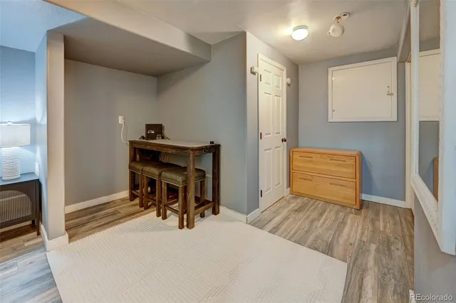 a workspace with furniture and wooden floor