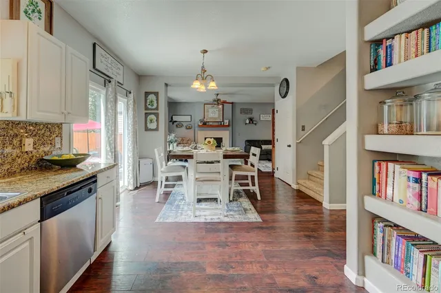 a open kitchen with cabinets a sink and appliances