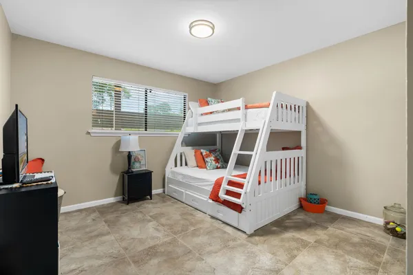 a room with furniture and white walls