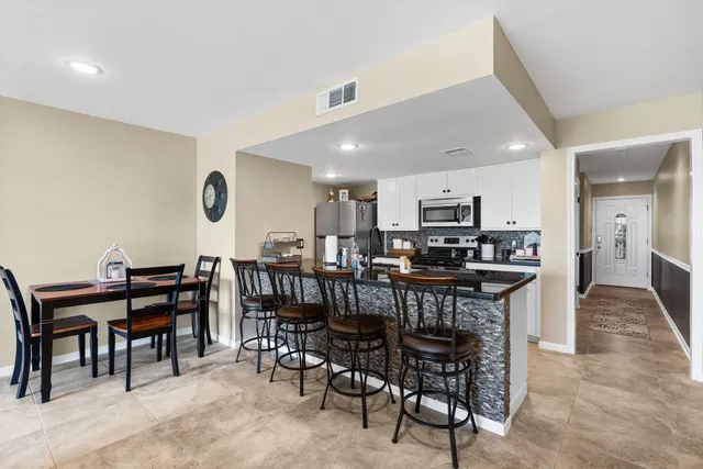 a view of a dining room with furniture