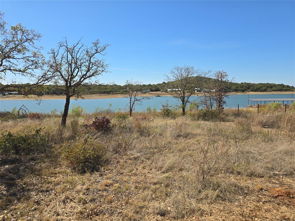133 Scenic Ridge Drive, Unit LOT 22 Cisco, TX 76437 - Photo 18 of 22 a view of lake with a yard