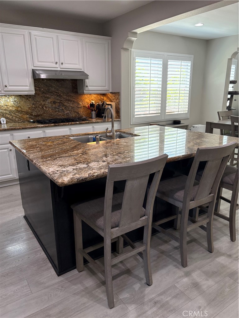 17115 Noble View Circle Riverside, CA 92503 - Photo 7 of 53 Kitchen Island, Stainless Sink and view of Casual Dining Table for four on the right side of the Kitchen.