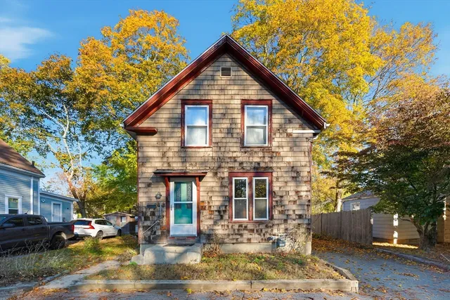 a front view of a house with a yard