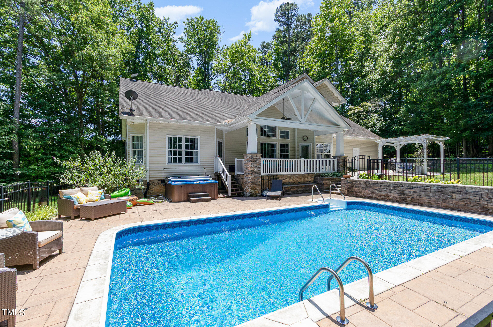679 Roberts Chapel Road Stem, NC 27581 - Photo 1 of 28 a view of a house with pool and chairs