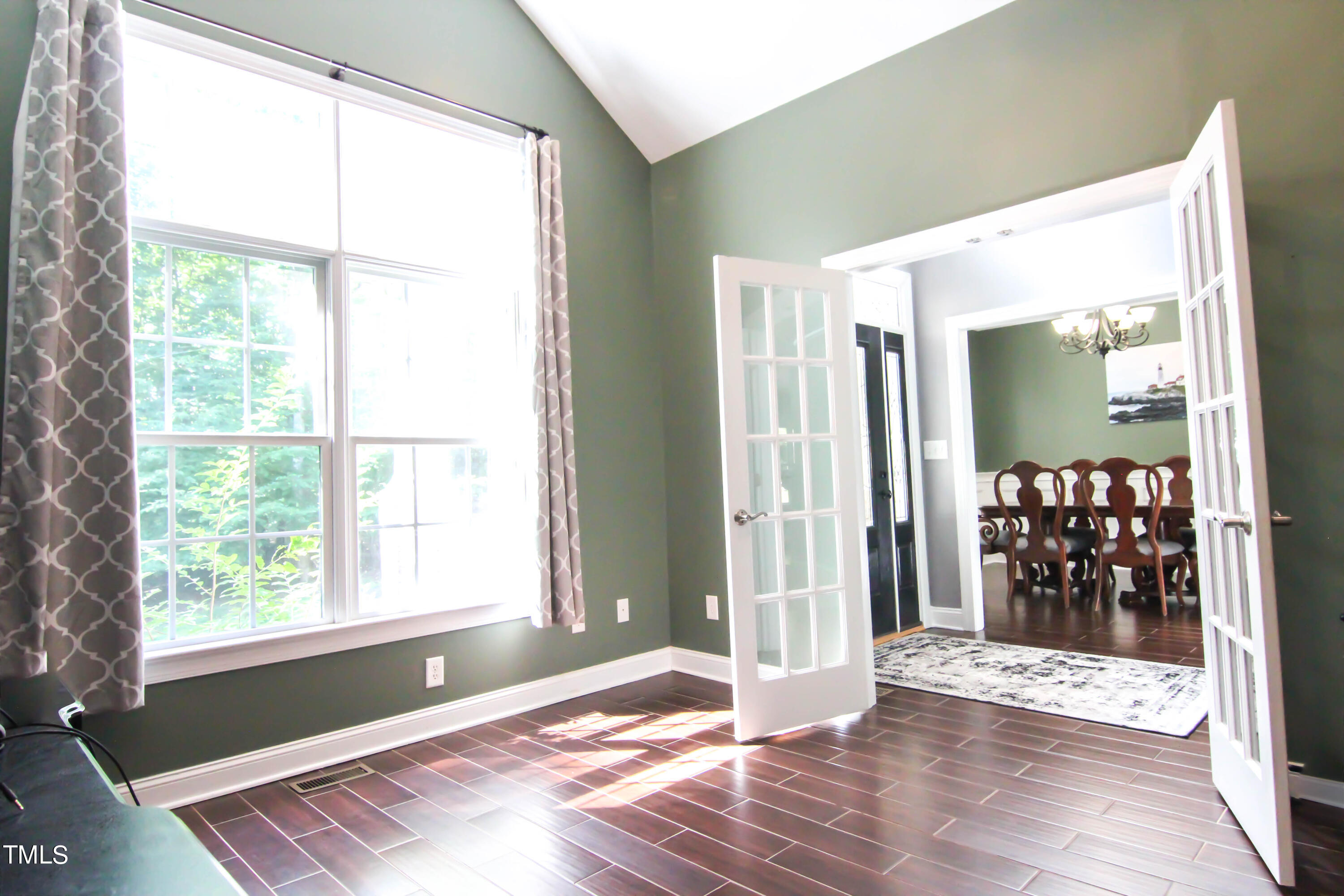 679 Roberts Chapel Road Stem, NC 27581 - Photo 14 of 28 a view of an empty room with wooden floor and a window
