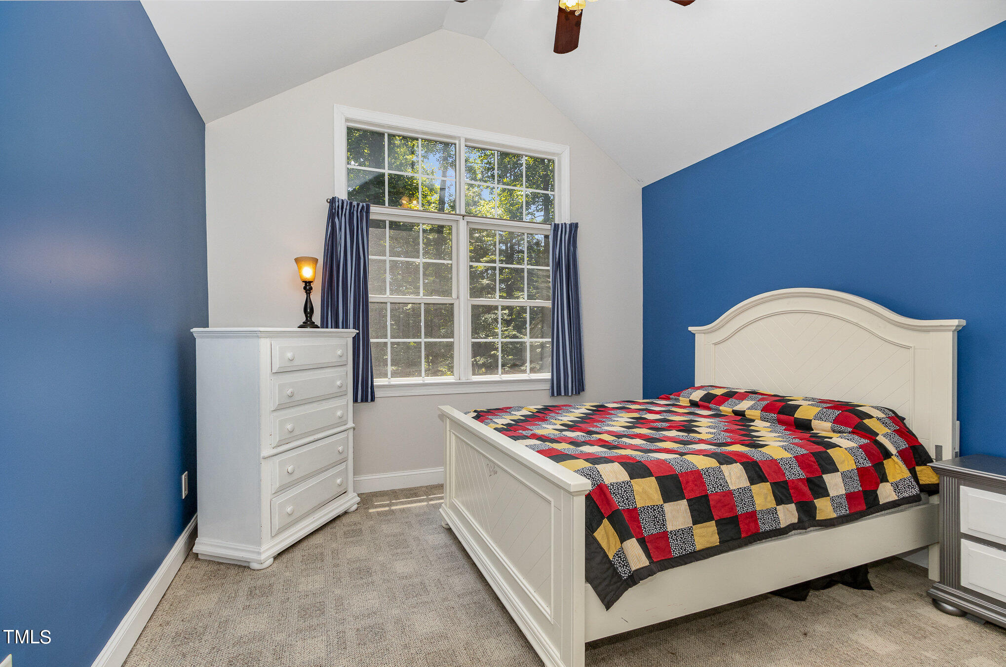 679 Roberts Chapel Road Stem, NC 27581 - Photo 16 of 28 a bedroom with a bed and a window