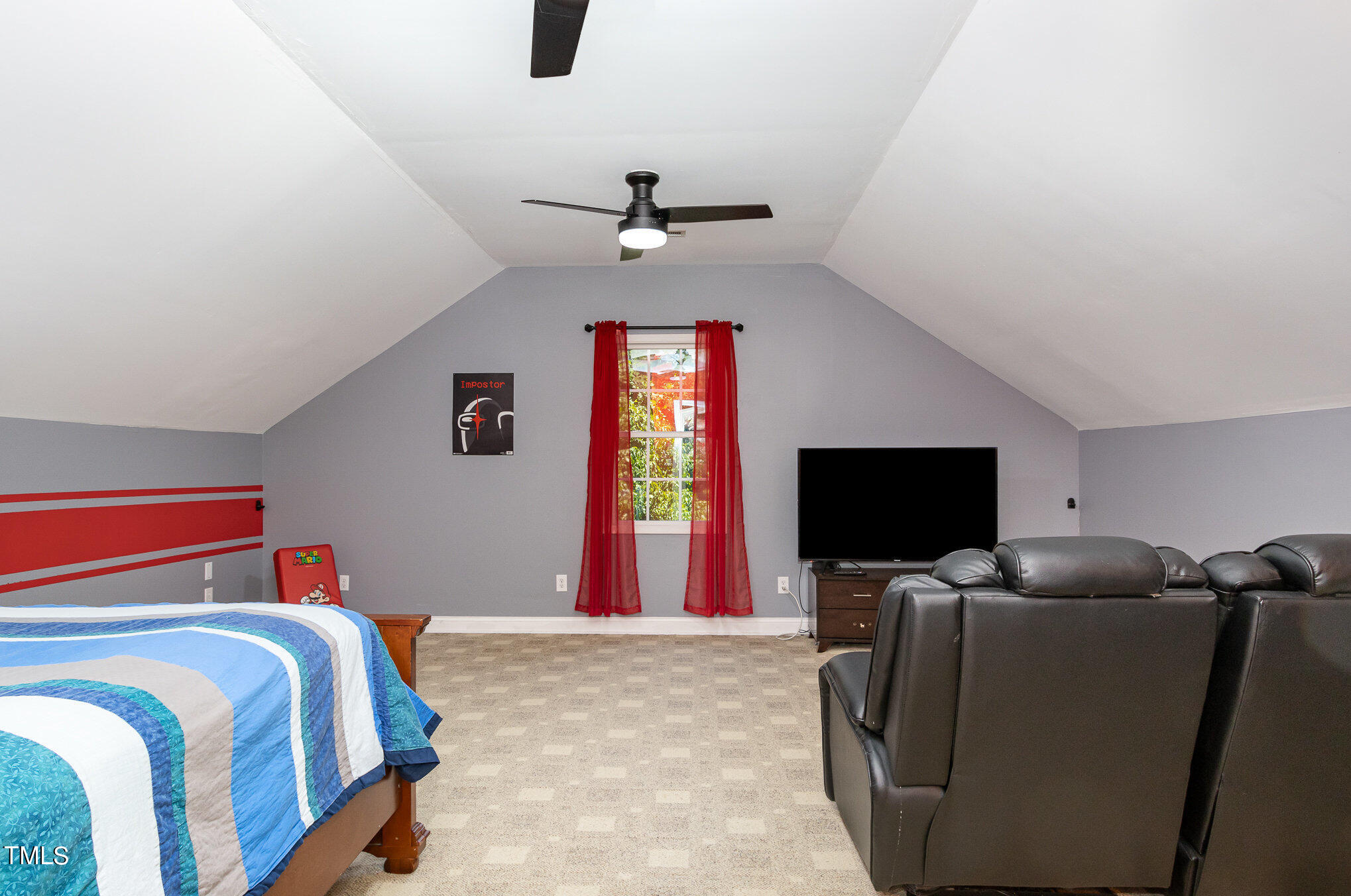 679 Roberts Chapel Road Stem, NC 27581 - Photo 18 of 28 a bedroom with a bed and a flat screen tv