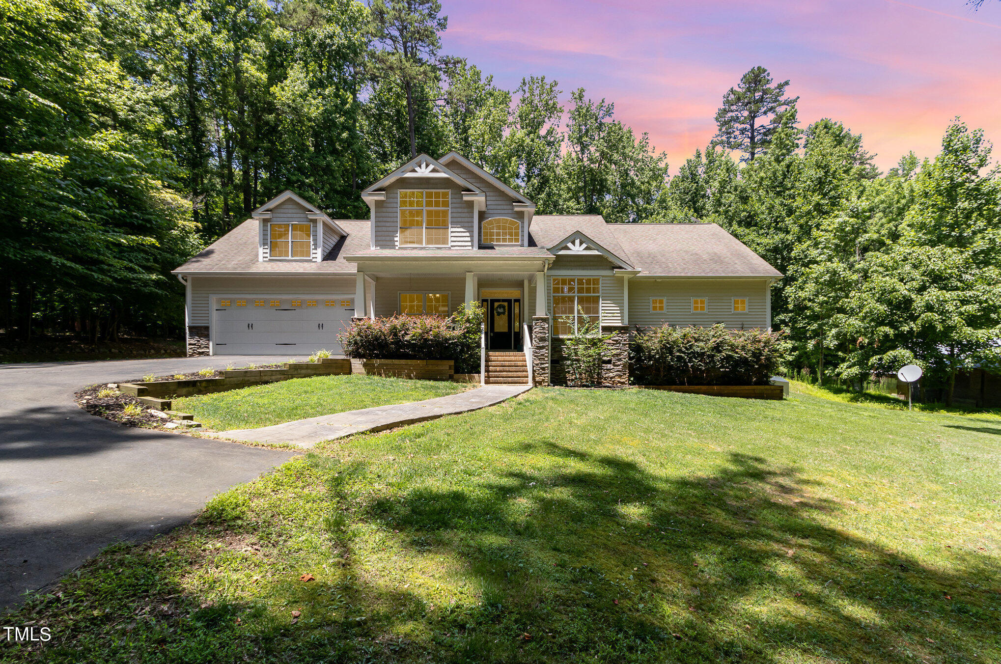 679 Roberts Chapel Road Stem, NC 27581 - Photo 2 of 28 a front view of a house with yard and green space