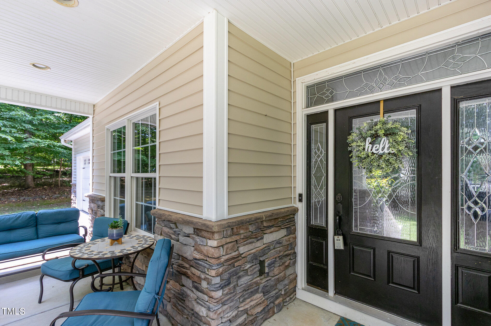 679 Roberts Chapel Road Stem, NC 27581 - Photo 3 of 28 a balcony with furniture and a gate