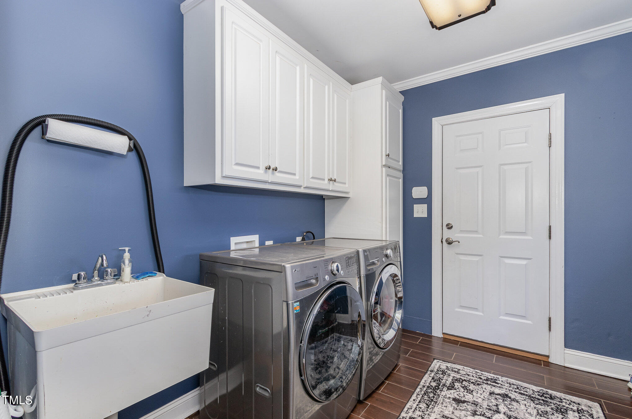 679 Roberts Chapel Road Stem, NC 27581 - Photo 9 of 28 a utility room with dryer and washer