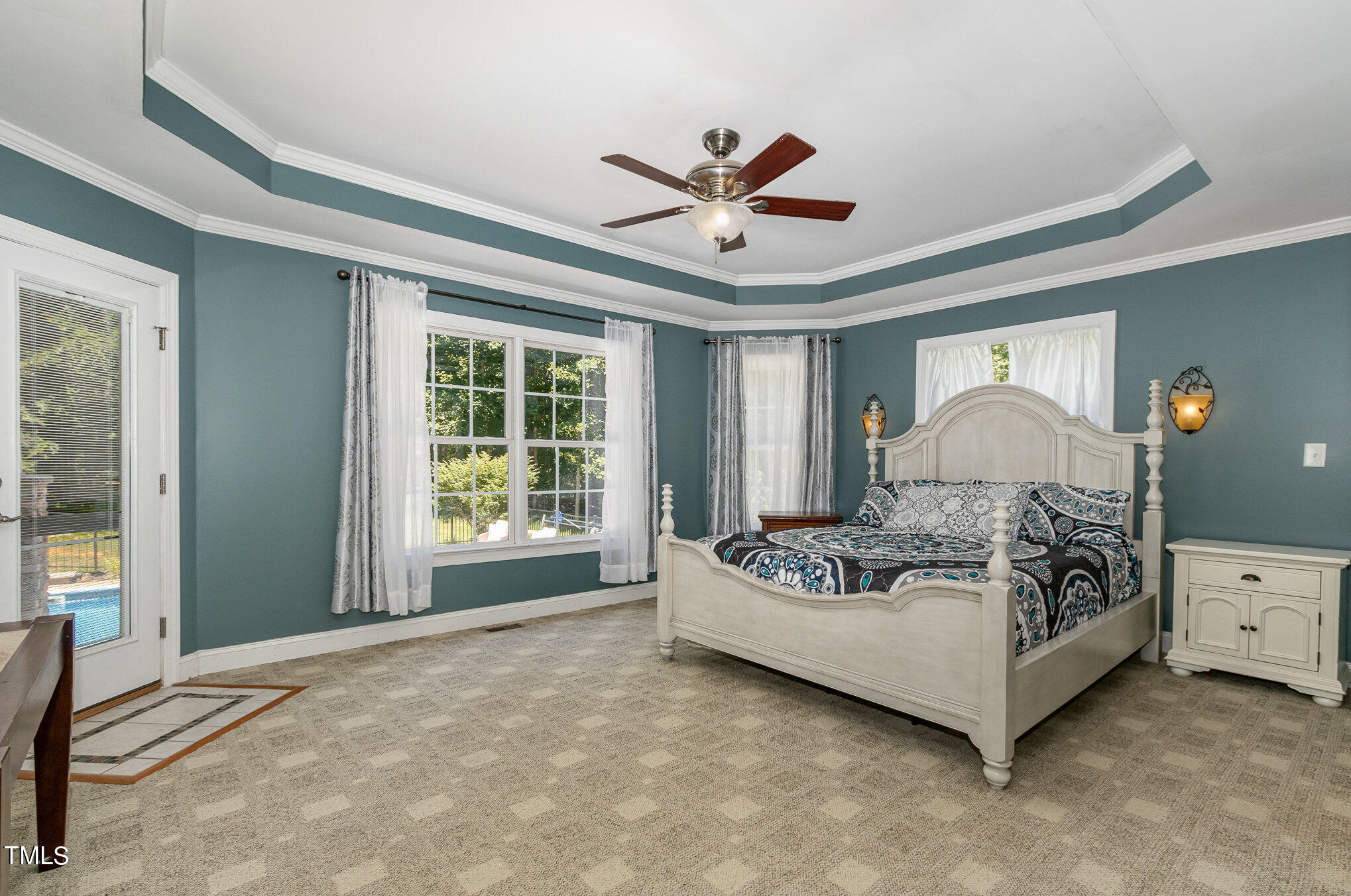 679 Roberts Chapel Road Stem, NC 27581 - Photo 10 of 28 a bed sitting in a spacious bedroom next to a window
