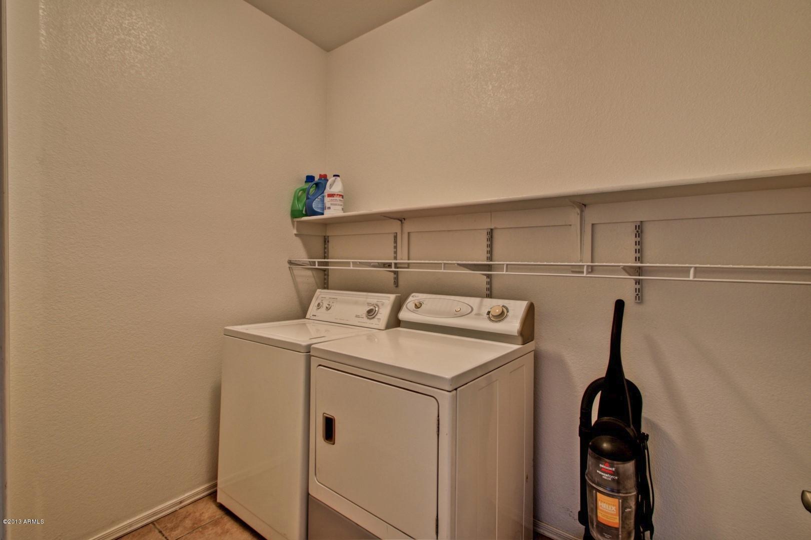 3227 West Maldonado Road Phoenix, AZ 85041 - Photo 12 of 28 Inside Laundry Room w/Storage Shelf