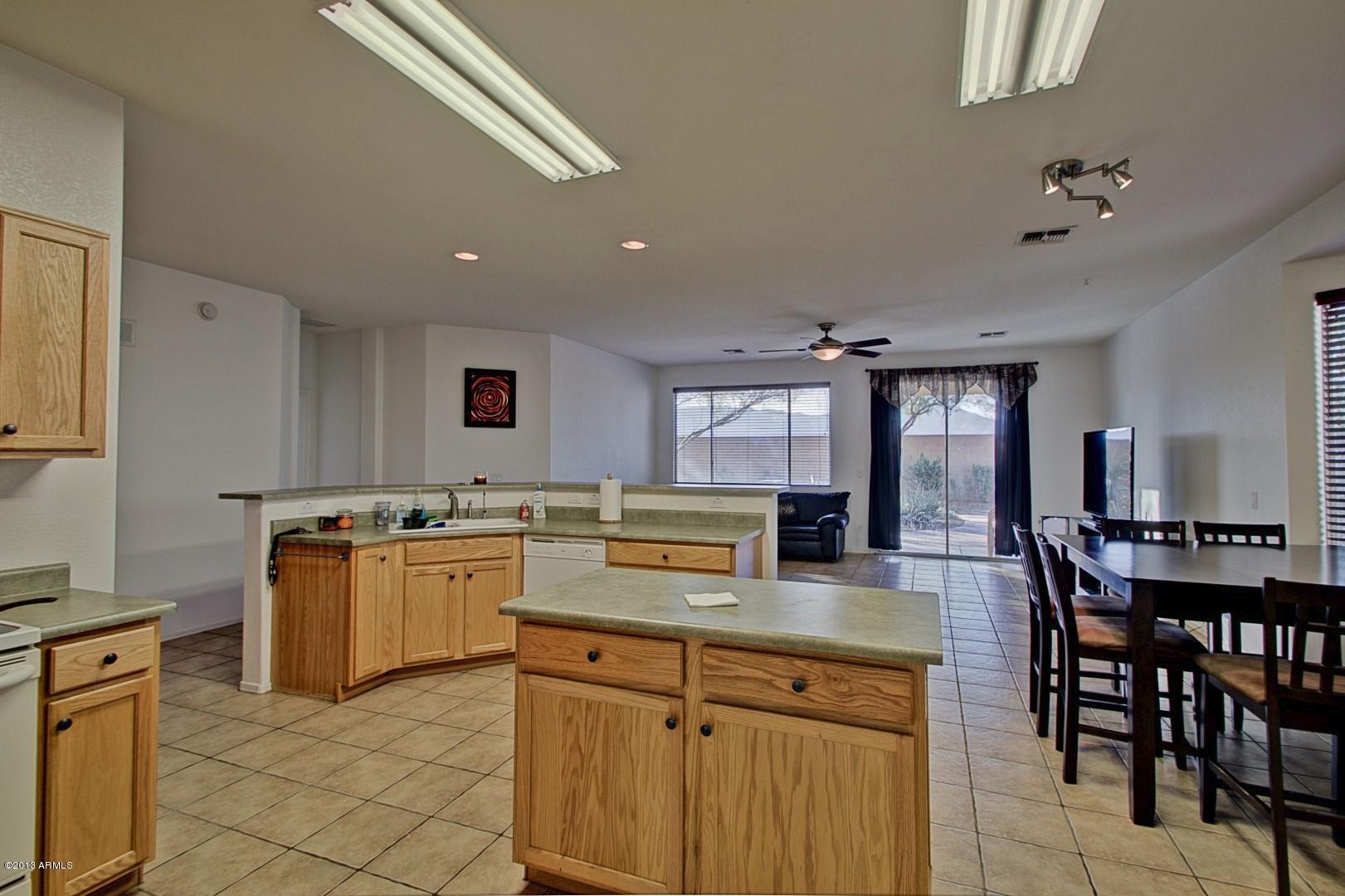 3227 West Maldonado Road Phoenix, AZ 85041 - Photo 10 of 28 Eat-In Kitchen w/Island