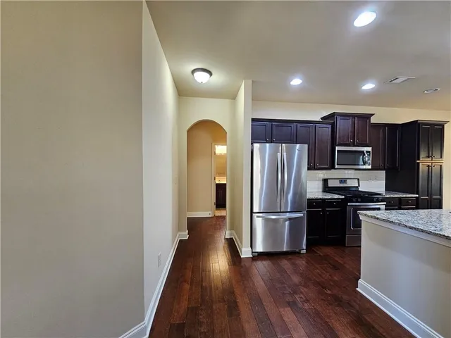 wooden floor in an empty room with a fireplace