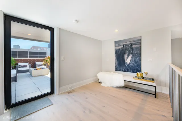 a bedroom with a bed and a painting on the wall
