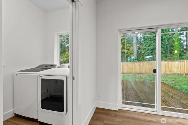 a view of storage and utility room with washer and dryer