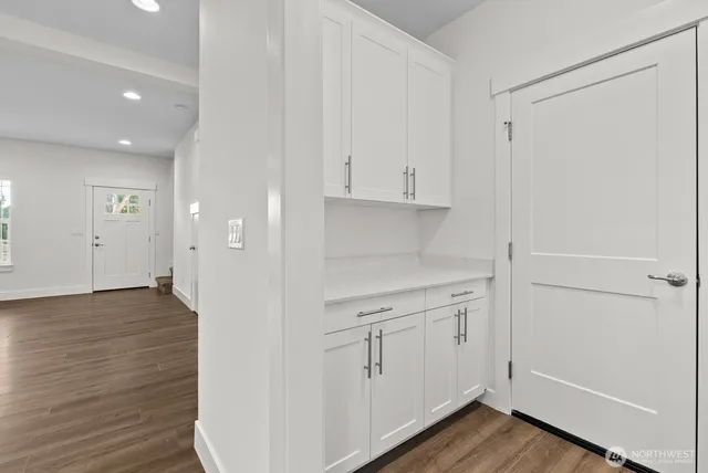 a view of cabinets with wooden floor