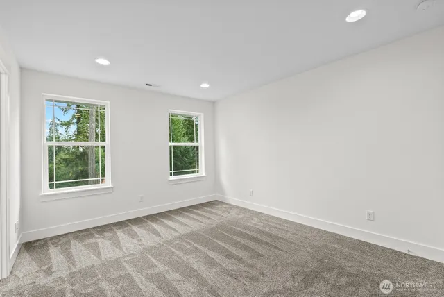 a bathroom with a sink double vanity and a mirror