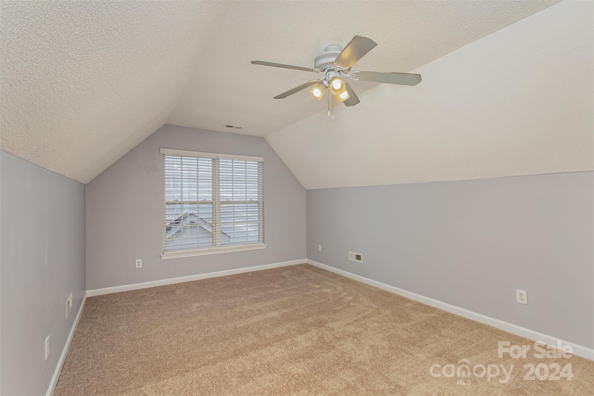 3917 Faith Church Road Indian Trail, NC 28079 - Photo 12 of 19 an empty room with windows and fan