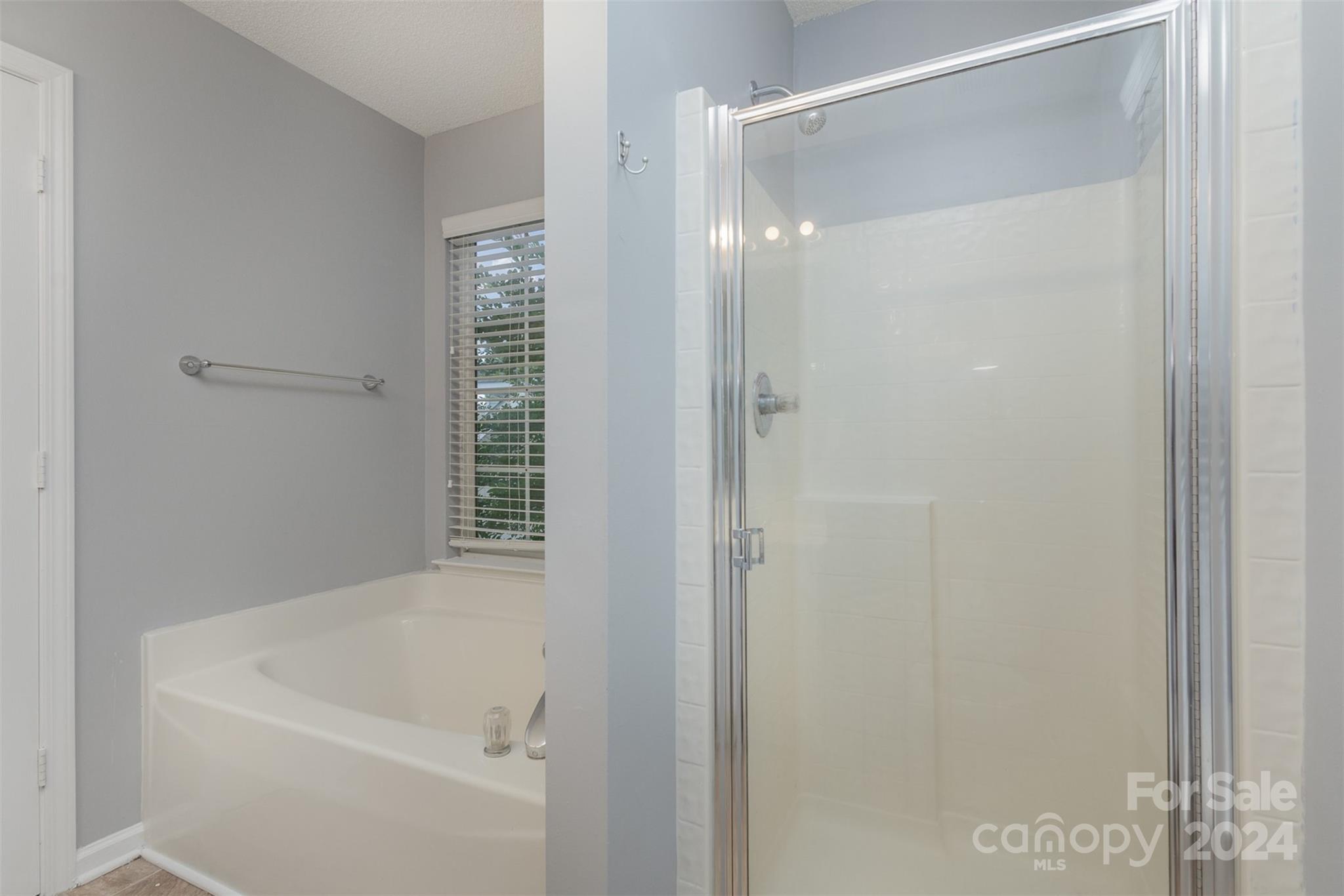 3917 Faith Church Road Indian Trail, NC 28079 - Photo 14 of 19 a bathroom with a bathtub