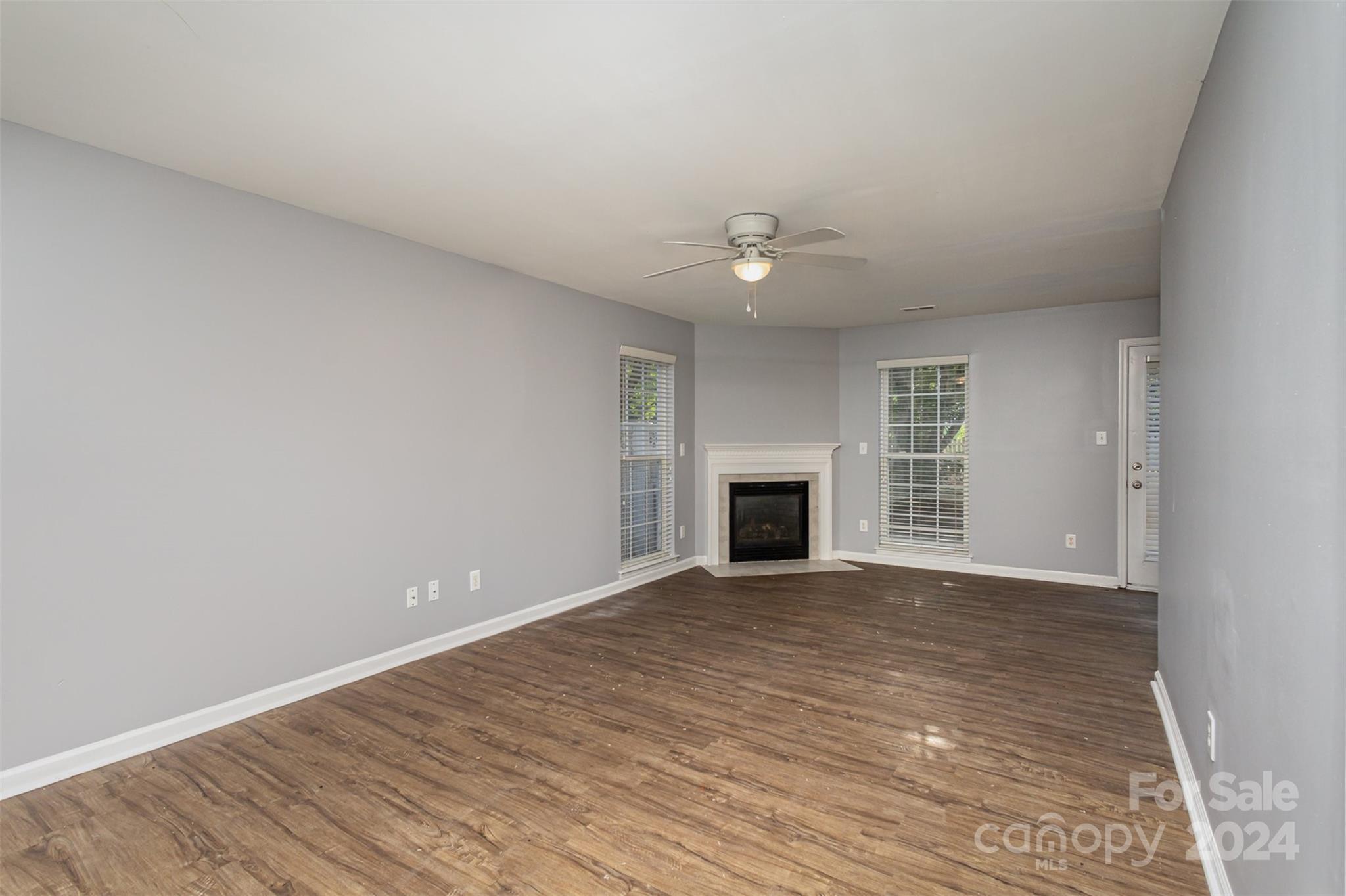 3917 Faith Church Road Indian Trail, NC 28079 - Photo 4 of 19 an empty room with windows and fireplace