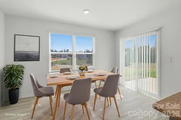 a view of a dining room with furniture window and outside view
