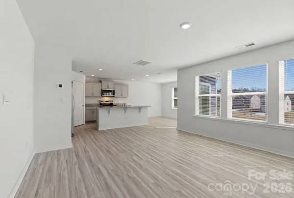 a view of kitchen with wooden floor and window
