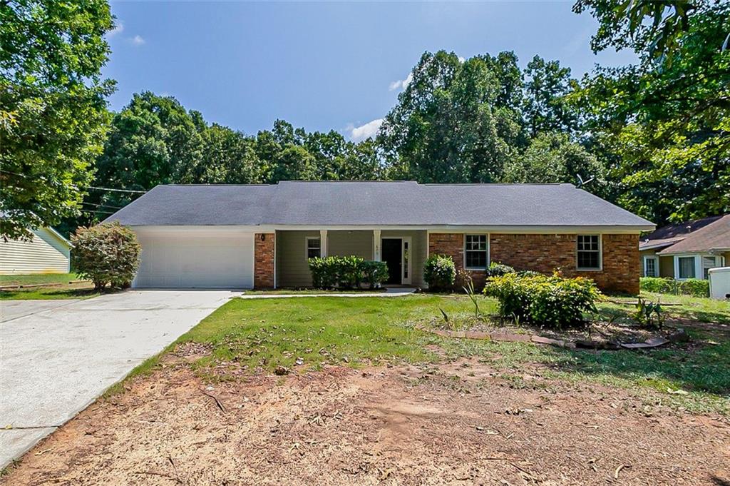 675 Cowan Road Covington, GA 30016 - Photo 1 of 1 front view of a house with a yard