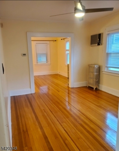29 Warman Street Montclair, NJ 07042 - Photo 3 of 4 a view of empty room with wooden floor and fan