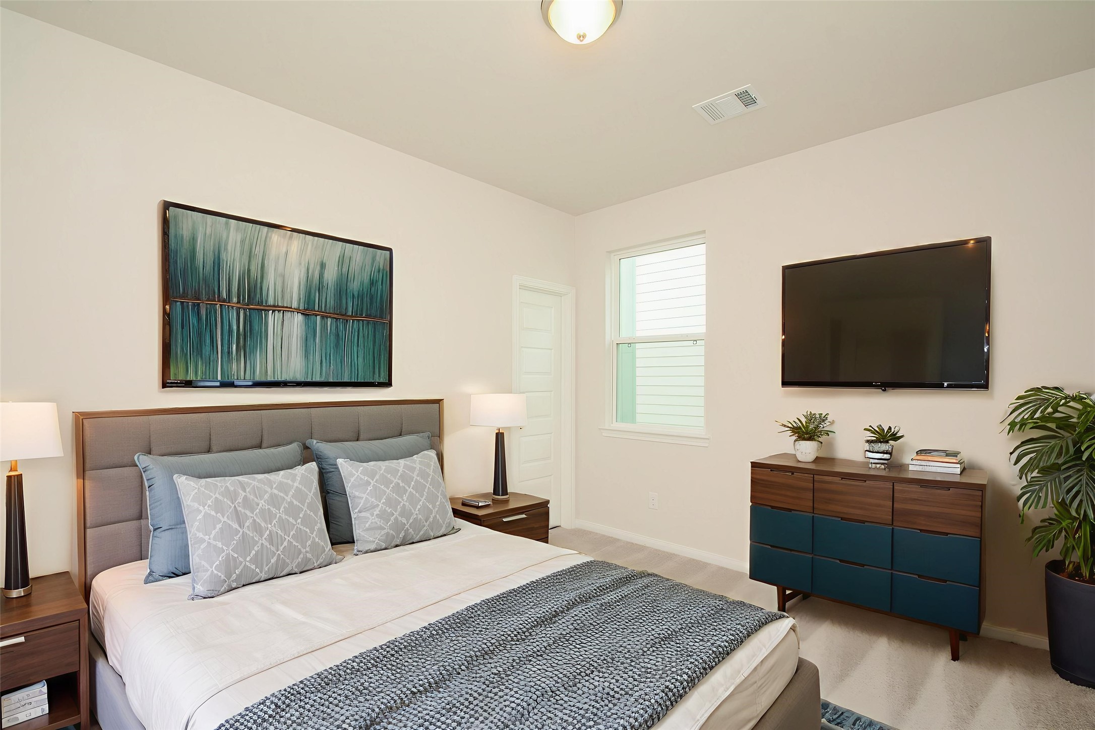 20642 Dynamic Court Humble, TX 77338 - Photo 20 of 32 a bedroom with a bed and a flat screen tv