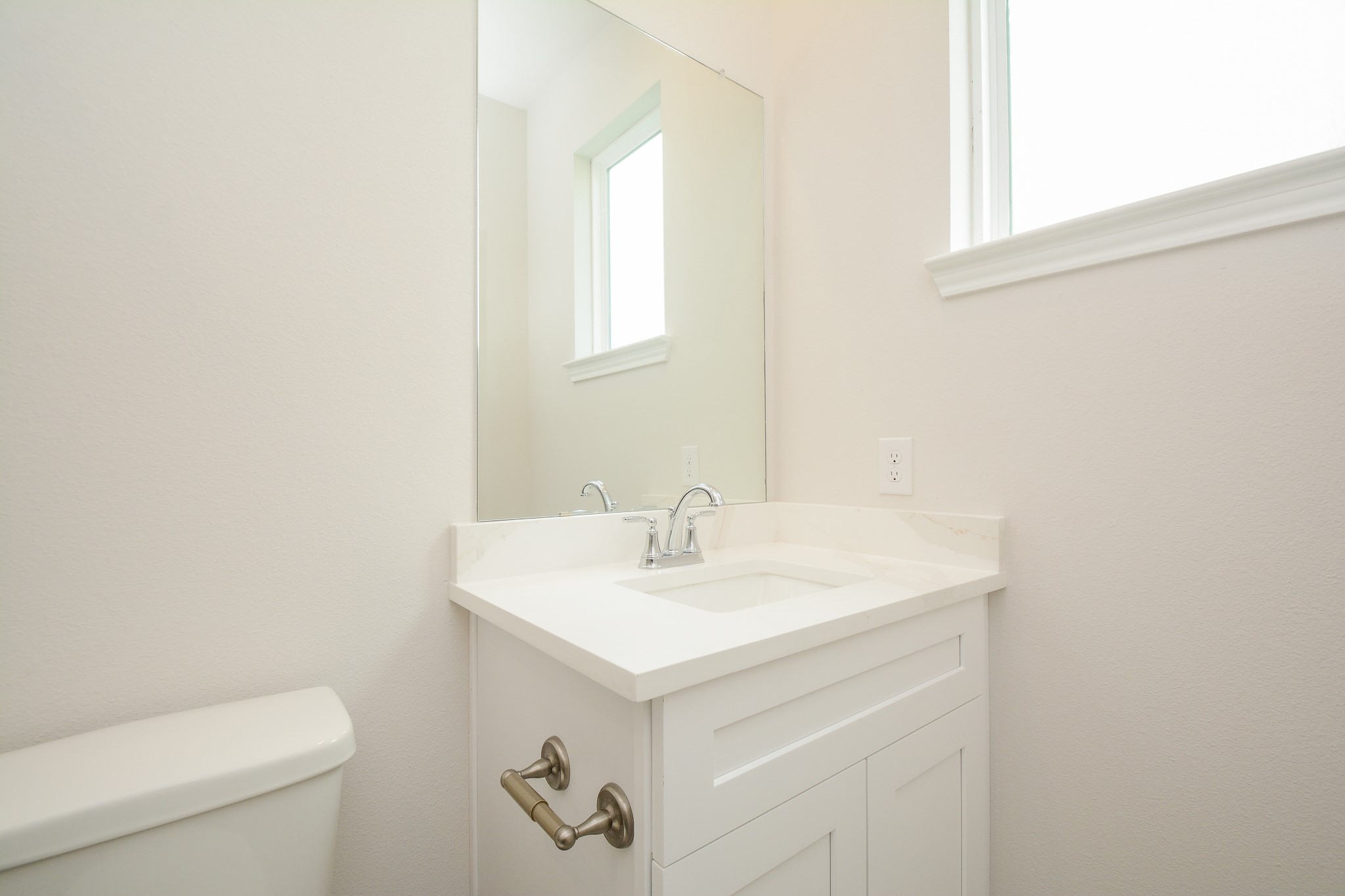 20642 Dynamic Court Humble, TX 77338 - Photo 24 of 32 a bathroom with a sink a toilet and a window