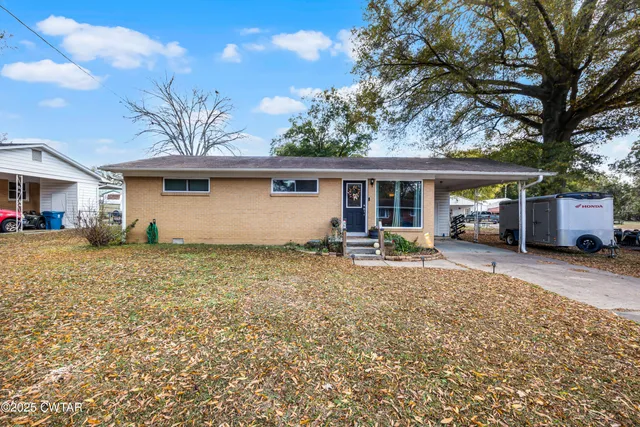 a front view of a house with a patio