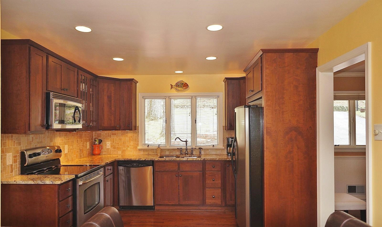 3113 Stoneridge Road Southwest Roanoke, VA 24014 - Photo 10 of 42 a kitchen with granite countertop a refrigerator stove top oven and sink