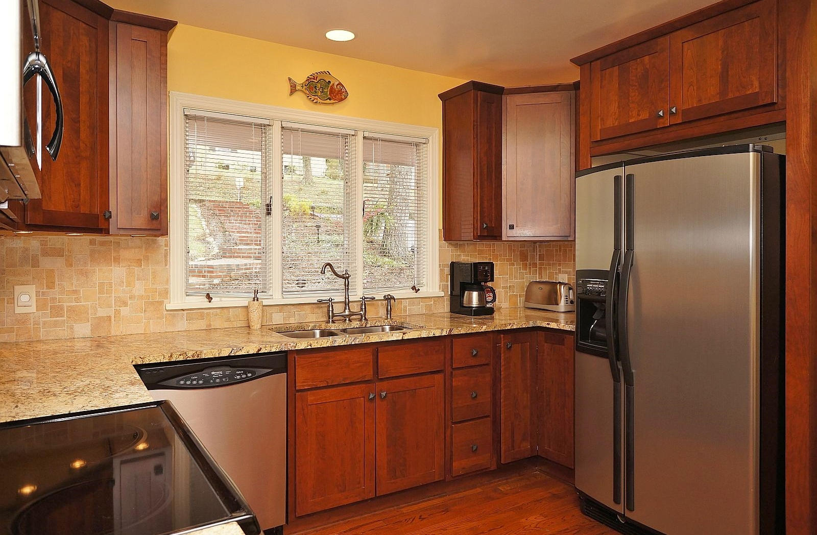 3113 Stoneridge Road Southwest Roanoke, VA 24014 - Photo 12 of 42 a kitchen with stainless steel appliances granite countertop a refrigerator and a sink