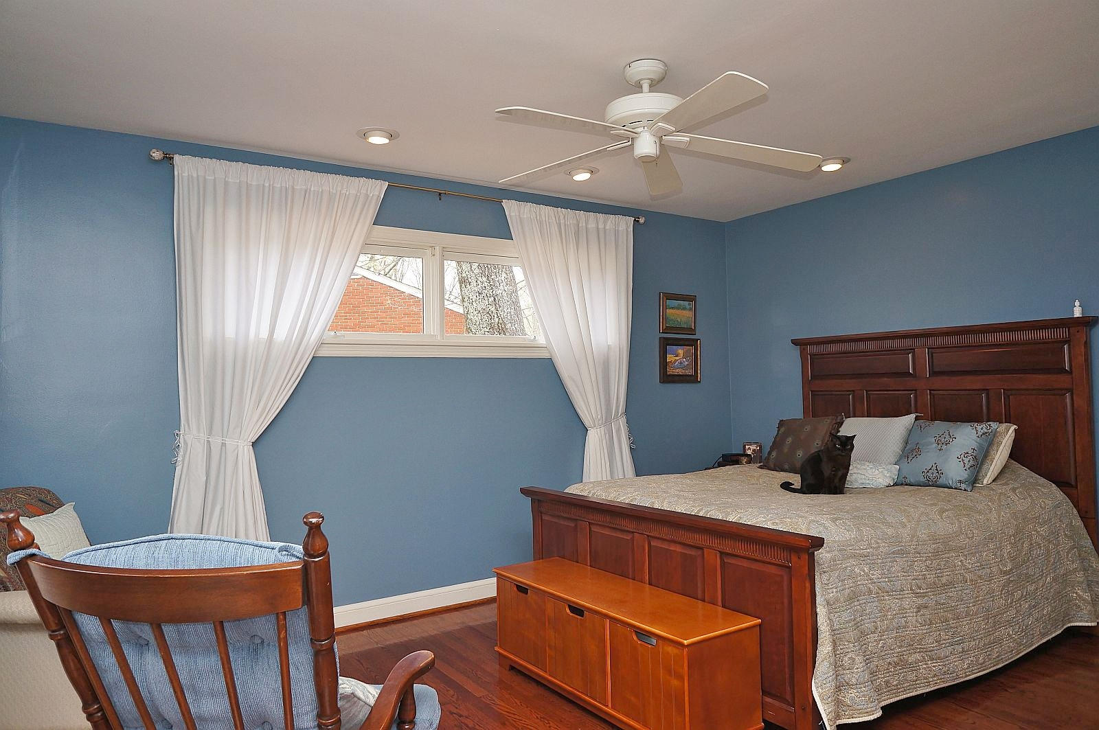 3113 Stoneridge Road Southwest Roanoke, VA 24014 - Photo 14 of 42 a bedroom with a large bed and a chandelier