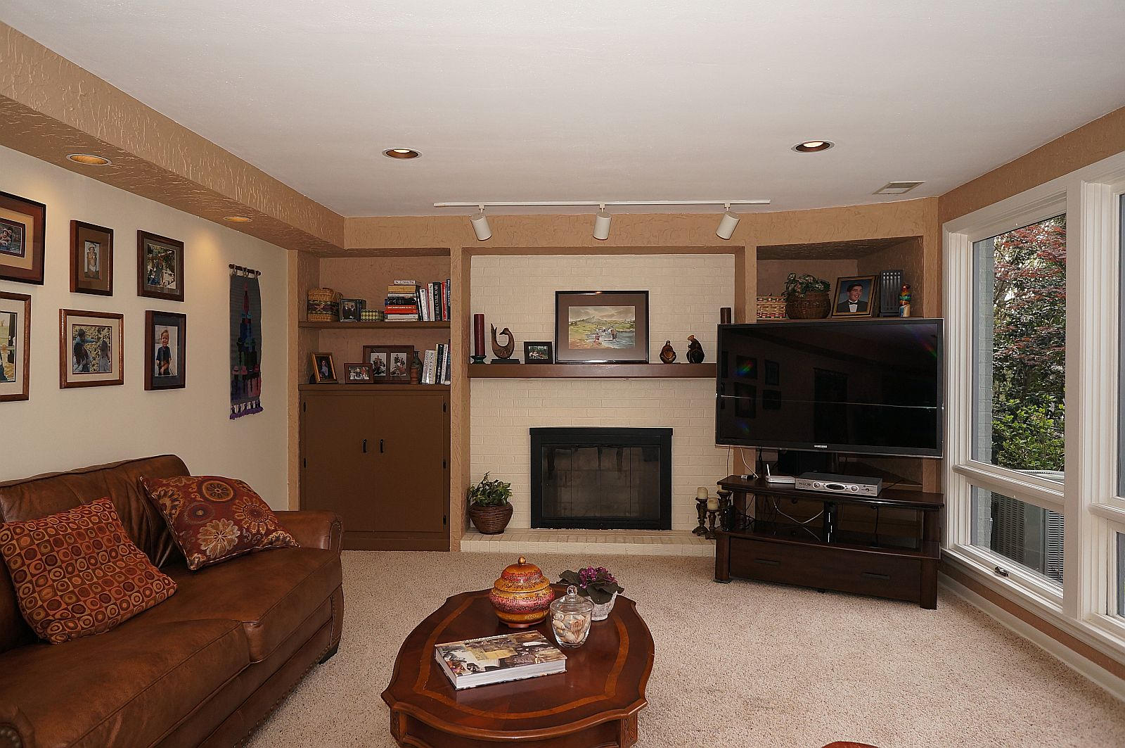 3113 Stoneridge Road Southwest Roanoke, VA 24014 - Photo 26 of 42 a living room with furniture and a flat screen tv