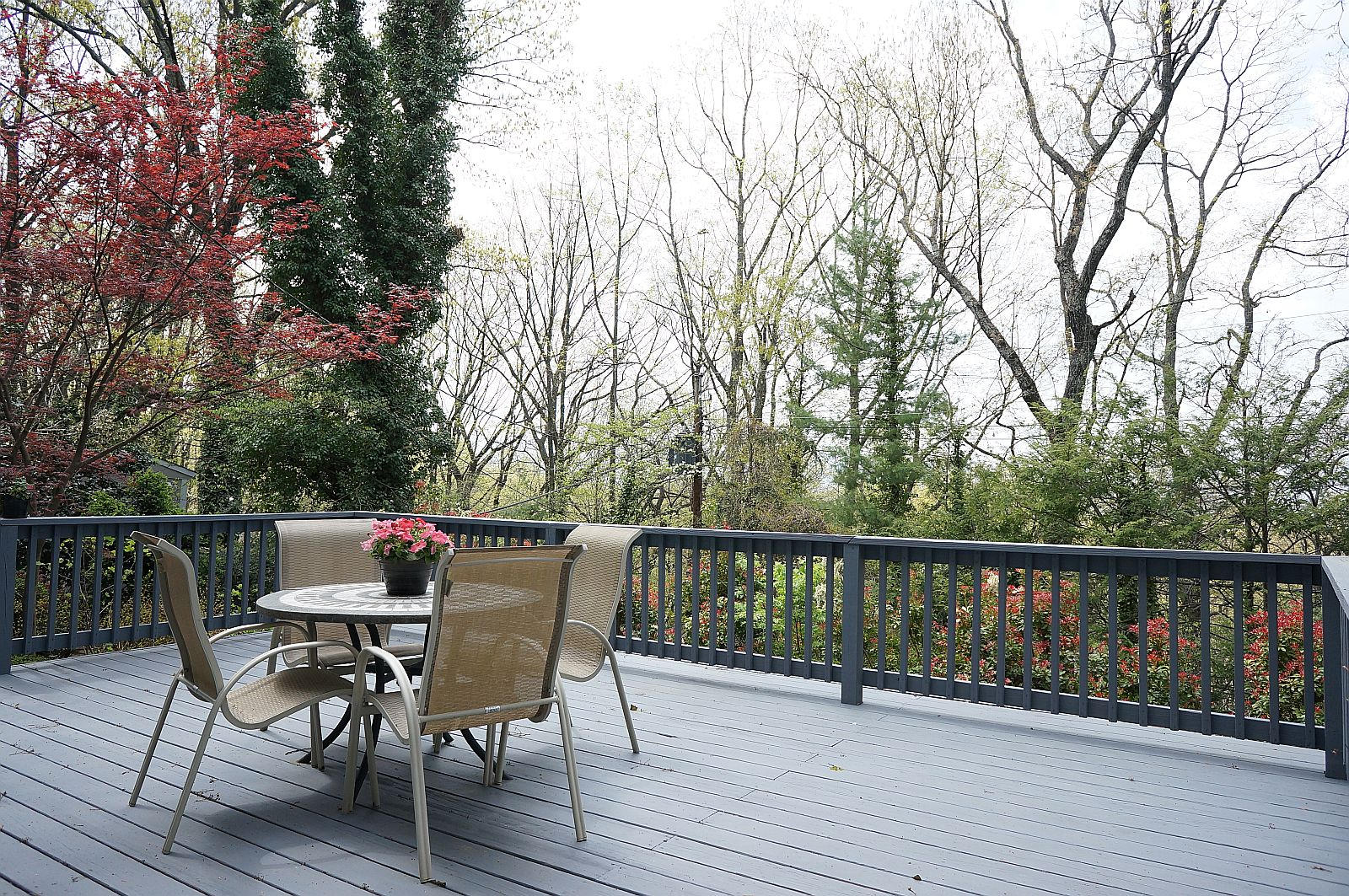 3113 Stoneridge Road Southwest Roanoke, VA 24014 - Photo 32 of 42 a view of a deck with table and chairs and wooden floor