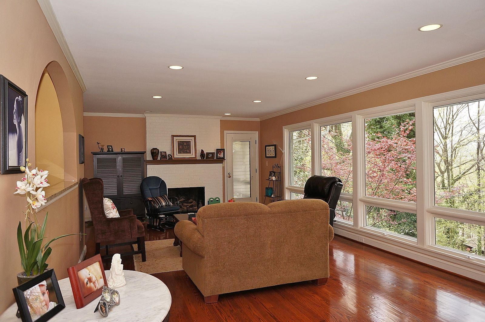 3113 Stoneridge Road Southwest Roanoke, VA 24014 - Photo 5 of 42 a living room with furniture a fireplace and a floor to ceiling window