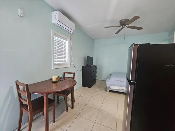 a dining room with furniture and window