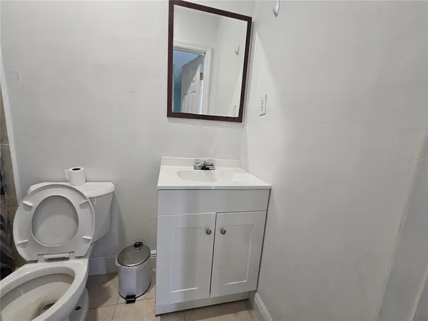 a bathroom with a shower and toilet
